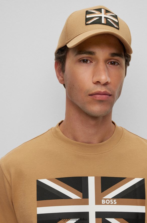 Hugo Boss beżowa czapka o splocie diagonalnym z logo Union Jack Hugo beżowy R0X0H65315