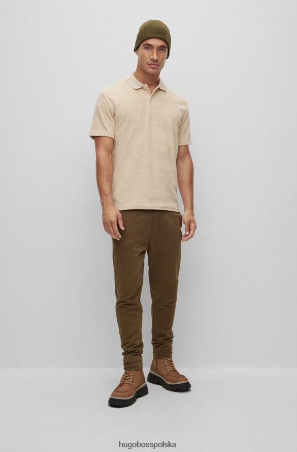 Hugo Boss ciemnozielona, ​​dzianinowa czapka typu beanie z tkanym logo hugo ciemnozielony R0X0H65113