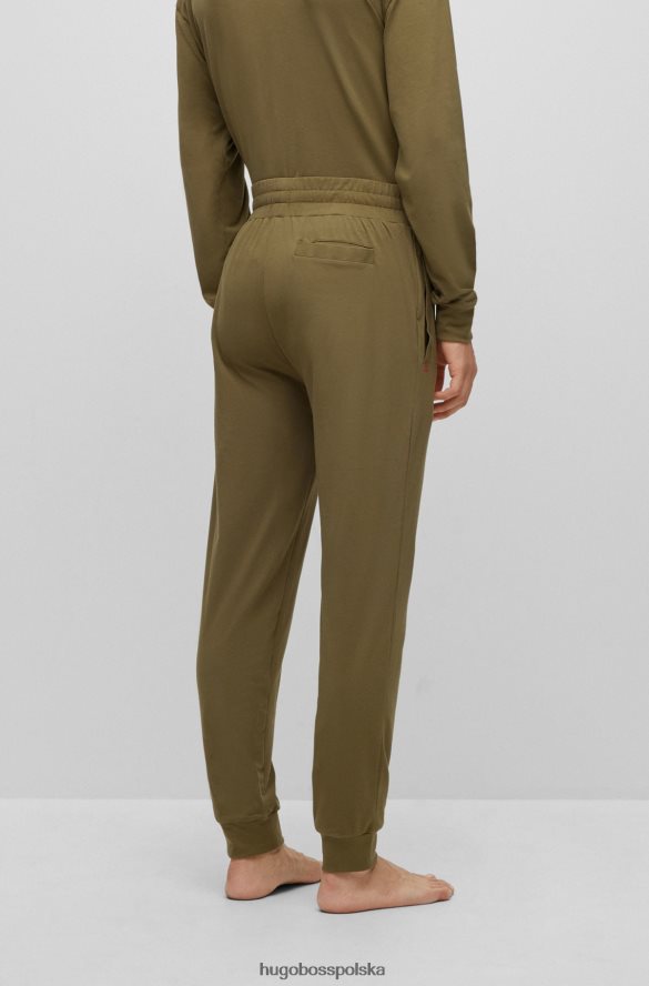 Hugo Boss Jasnozielone spodnie dresowe z elastycznej bawełny z czerwonym logo hugo jasnozielony R0X0H64402