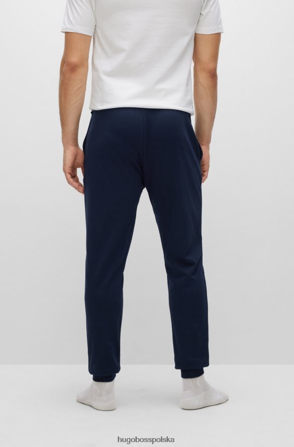 Hugo Boss Spodnie dresowe hugo z bawełny frotte z logo i paskami w kolorze ciemnoniebieskim ciemny niebieski R0X0H62672