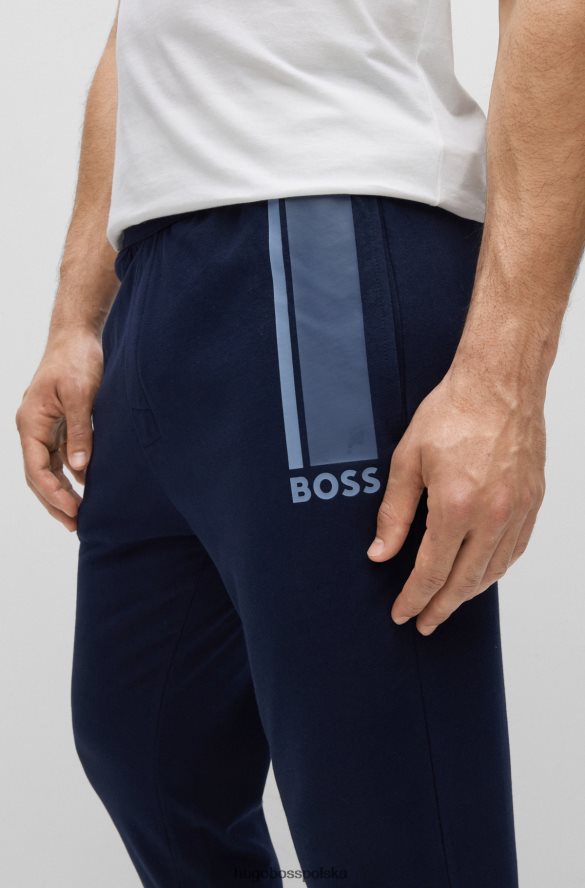 Hugo Boss Spodnie dresowe hugo z bawełny frotte z logo i paskami w kolorze ciemnoniebieskim ciemny niebieski R0X0H62672