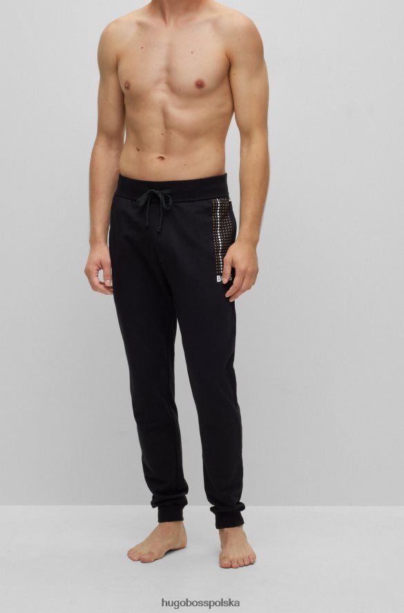 Hugo Boss Spodnie dresowe z bawełny frotte w paski w kropki i czarne logo hugo czarny R0X0H63261