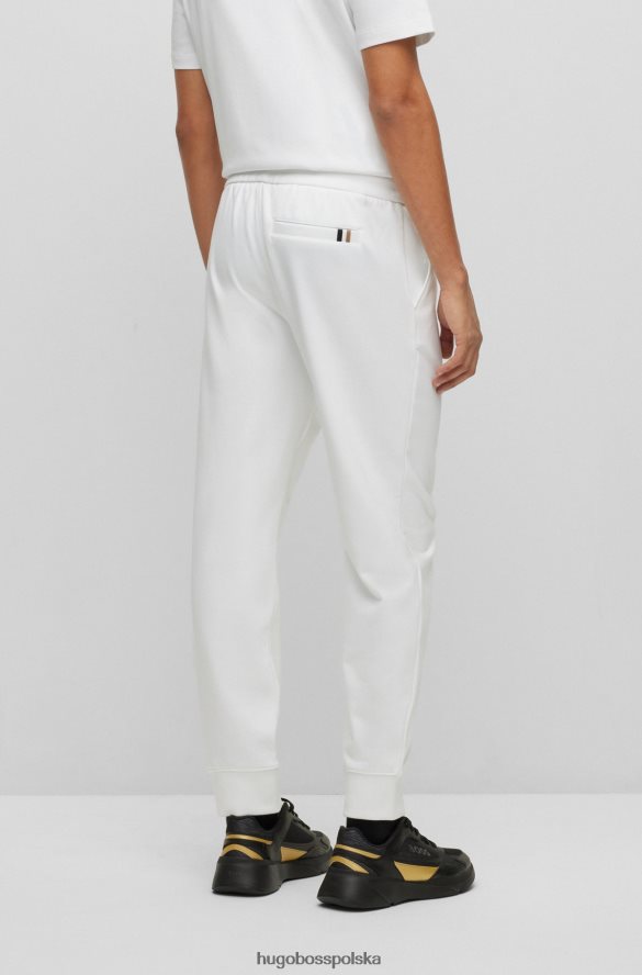 Hugo Boss Białe spodnie dresowe hugo z bawełny frotte i logo wypełnionym monogramami biały R0X0H62635