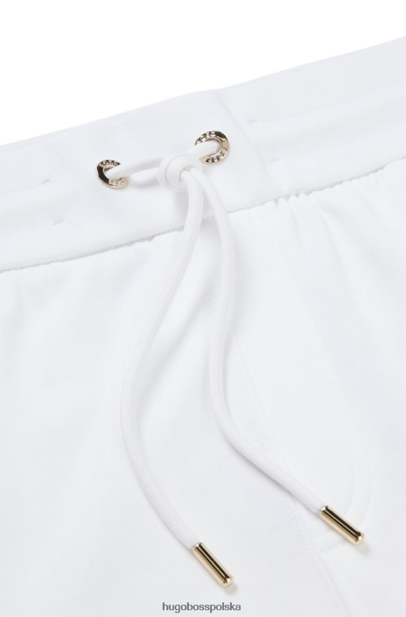 Hugo Boss Białe spodnie dresowe hugo z bawełny frotte i logo wypełnionym monogramami biały R0X0H62635
