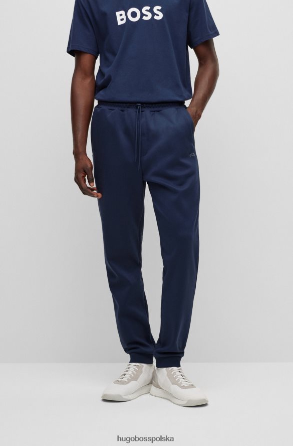 Hugo Boss Ciemnoniebieskie bawełniane spodnie dresowe z zakrzywionym logo hugo ciemny niebieski R0X0H62533