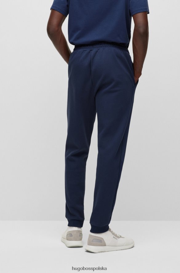 Hugo Boss Ciemnoniebieskie bawełniane spodnie dresowe z zakrzywionym logo hugo ciemny niebieski R0X0H62533