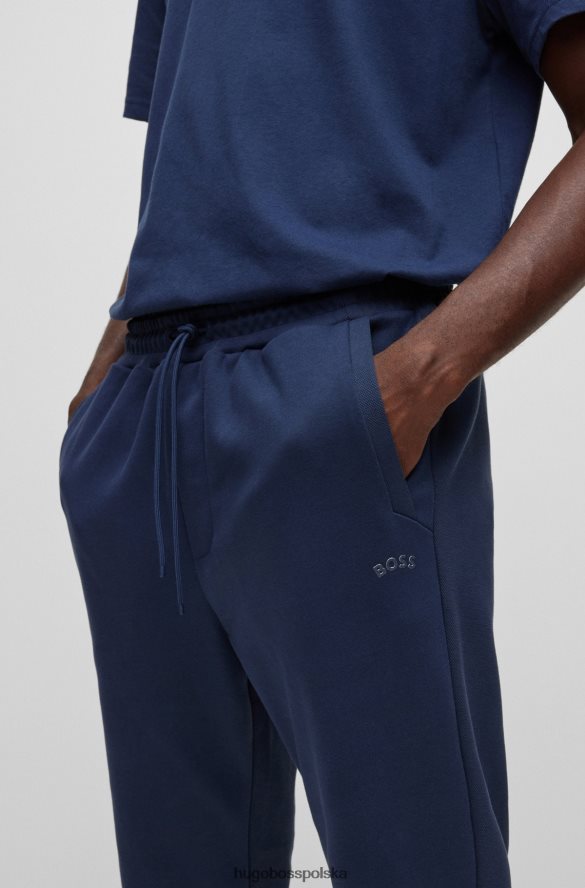 Hugo Boss Ciemnoniebieskie bawełniane spodnie dresowe z zakrzywionym logo hugo ciemny niebieski R0X0H62533
