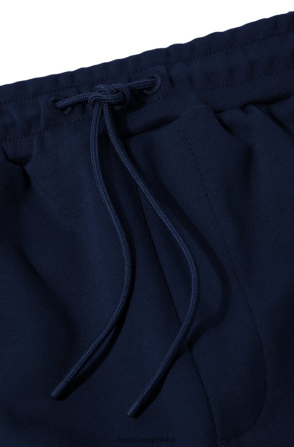 Hugo Boss Ciemnoniebieskie bawełniane spodnie dresowe z zakrzywionym logo hugo ciemny niebieski R0X0H62533
