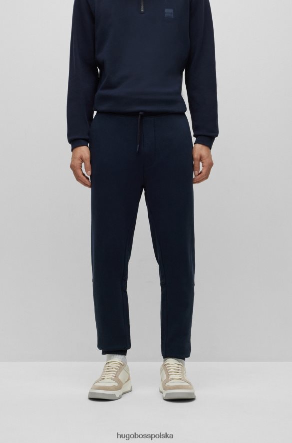 Hugo Boss Ciemnoniebieskie spodnie dresowe hugo z bawełny frotte i naszywką z logo ciemny niebieski R0X0H61436