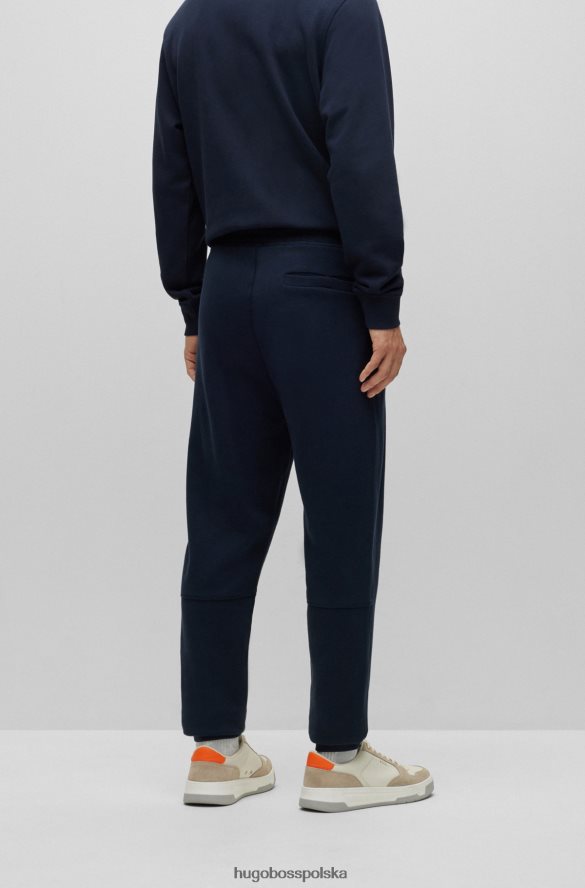 Hugo Boss Ciemnoniebieskie spodnie dresowe hugo z bawełny frotte i naszywką z logo ciemny niebieski R0X0H61436
