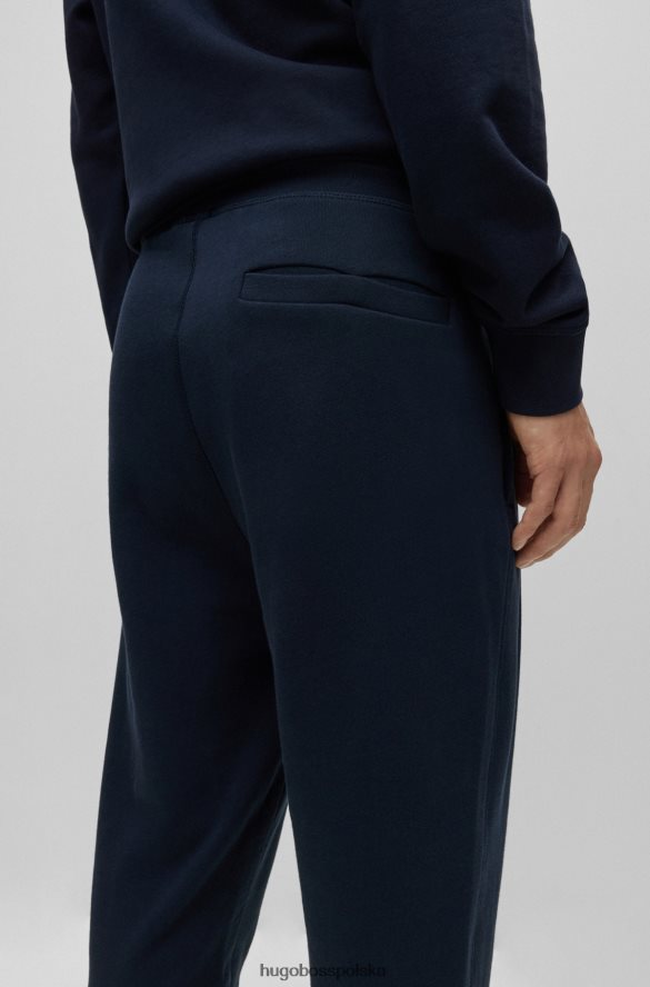 Hugo Boss Ciemnoniebieskie spodnie dresowe hugo z bawełny frotte i naszywką z logo ciemny niebieski R0X0H61436