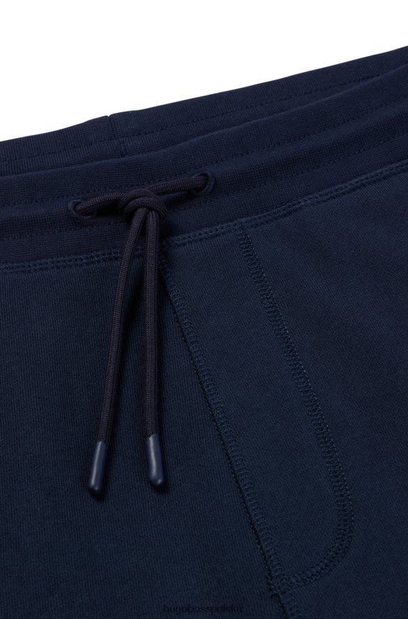 Hugo Boss Ciemnoniebieskie spodnie dresowe hugo z bawełny frotte i naszywką z logo ciemny niebieski R0X0H61436
