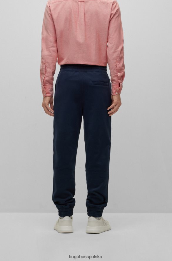 Hugo Boss Ciemnoniebieskie spodnie dresowe z mieszanki bawełny z kontrastowym logo hugo ciemny niebieski R0X0H64147
