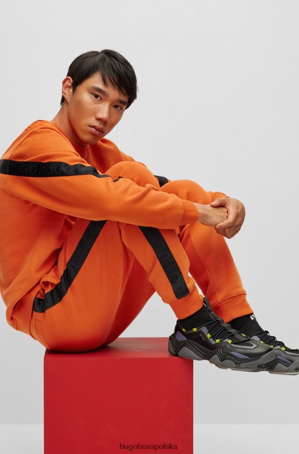 Hugo Boss Ciemnopomarańczowe spodnie dresowe Hugo z bawełny organicznej z taśmą z logo ciemna pomarańcza R0X0H61573