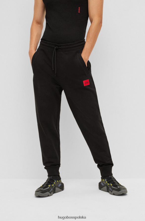 Hugo Boss Czarne, bawełniane spodnie dresowe hugo z czerwoną naszywką z logo czarny R0X0H62077