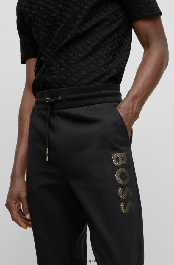 Hugo Boss Czarne spodnie dresowe hugo z bawełny frotte i logo wypełnionym monogramami czarny R0X0H62634