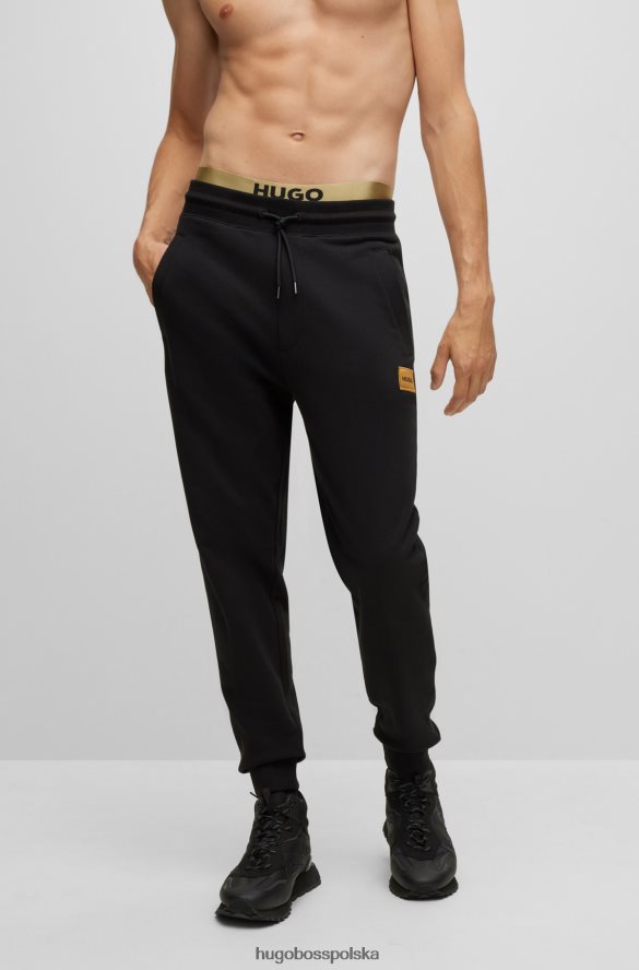 Hugo Boss Czarne spodnie dresowe hugo z bawełny frotte i logo z nadrukiem foliowym czarny R0X0H64109
