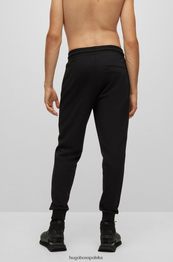 Hugo Boss Czarne spodnie dresowe hugo z bawełny frotte i logo z nadrukiem foliowym czarny R0X0H64109