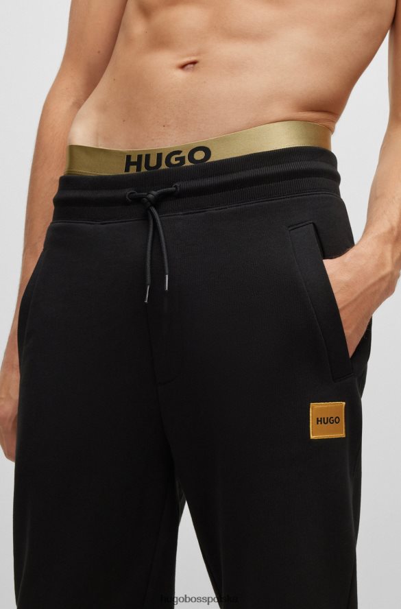 Hugo Boss Czarne spodnie dresowe hugo z bawełny frotte i logo z nadrukiem foliowym czarny R0X0H64109