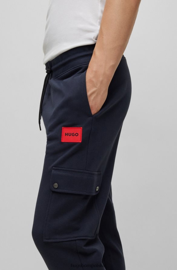 Hugo Boss Hugo Spodnie dresowe o swobodnym kroju z bawełny frotte i kieszenią cargo w kolorze ciemnoniebieskim ciemny niebieski R0X0H62165