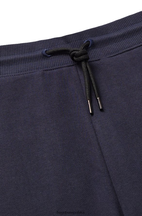 Hugo Boss Hugo Spodnie dresowe o swobodnym kroju z bawełny frotte i kieszenią cargo w kolorze ciemnoniebieskim ciemny niebieski R0X0H62165