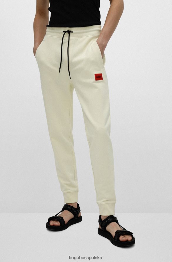 Hugo Boss Jasnożółte bawełniane spodnie dresowe hugo z czerwoną naszywką z logo jasny zółty R0X0H62078