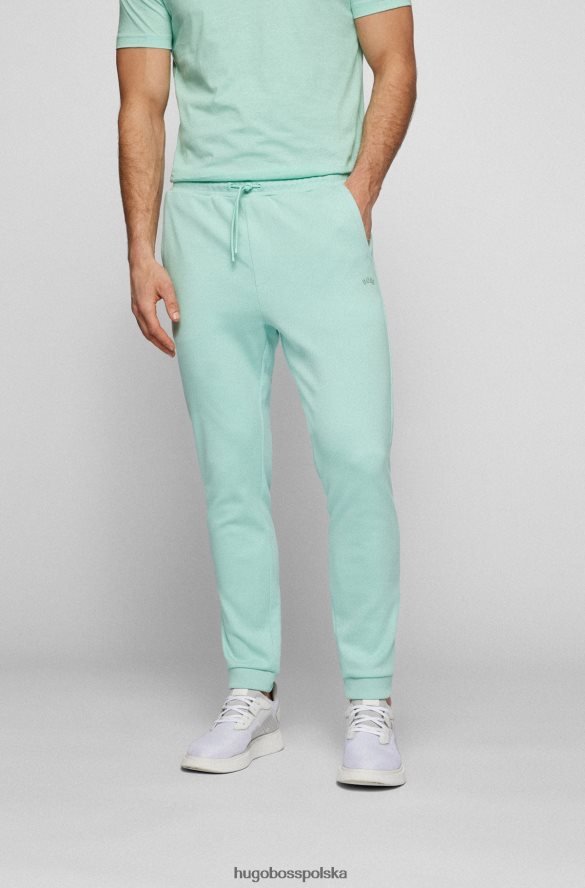 Hugo Boss Jasnozielone, bawełniane spodnie dresowe Hugo z zaokrąglonym logo jasnozielony R0X0H62535