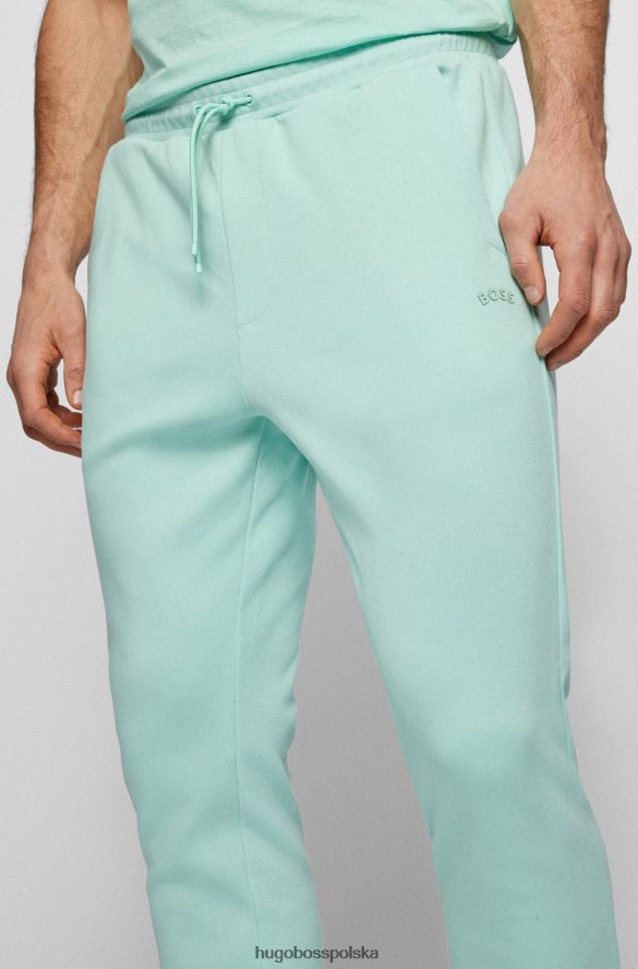 Hugo Boss Jasnozielone, bawełniane spodnie dresowe Hugo z zaokrąglonym logo jasnozielony R0X0H62535