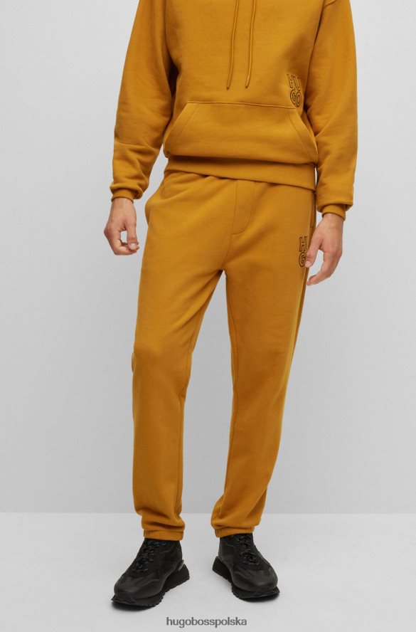 Hugo Boss Pomarańczowe spodnie dresowe hugo z bawełny organicznej z mankietami i logo Pomarańczowy R0X0H64518