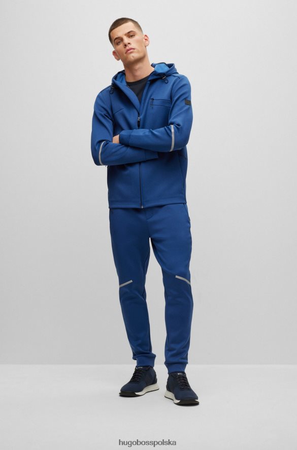 Hugo Boss Spodnie dresowe hugo o regularnym kroju, melanżowe, z ozdobnymi odblaskowymi detalami w kolorze ciemnoniebieskim ciemny niebieski R0X0H63537