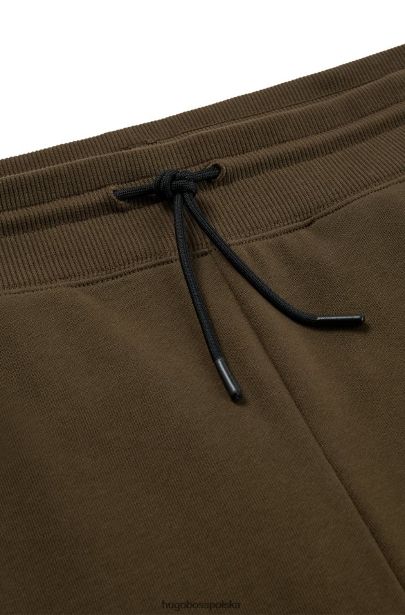 Hugo Boss Spodnie dresowe hugo z bawełny frotte i ciemnozielonym logo w czerwonej ramce ciemnozielony R0X0H61068