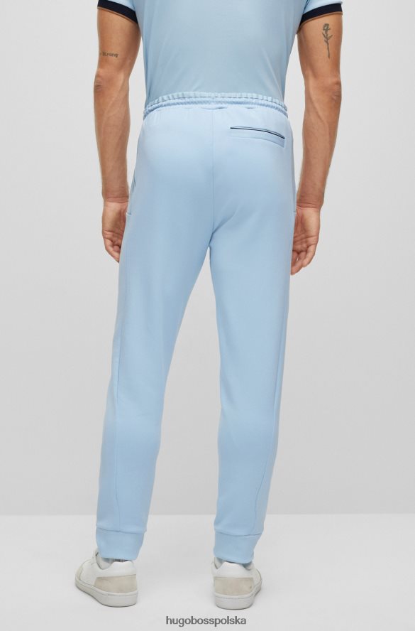 Hugo Boss Spodnie dresowe hugo z mieszanki bawełny z wielokolorowymi paskami w kolorze jasnoniebieskim jasny niebieski R0X0H61733