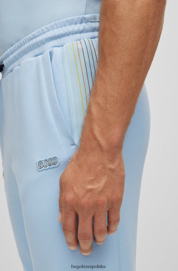Hugo Boss Spodnie dresowe hugo z mieszanki bawełny z wielokolorowymi paskami w kolorze jasnoniebieskim jasny niebieski R0X0H61733