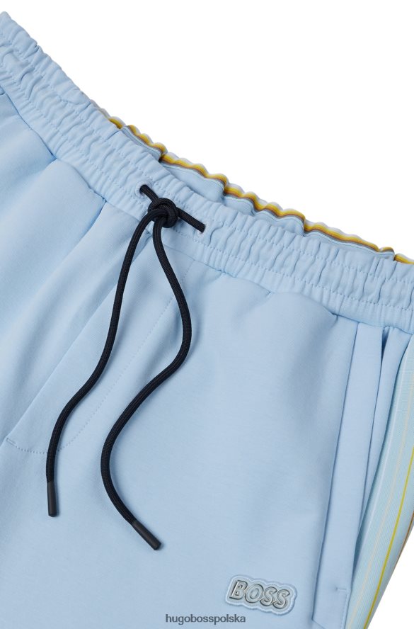 Hugo Boss Spodnie dresowe hugo z mieszanki bawełny z wielokolorowymi paskami w kolorze jasnoniebieskim jasny niebieski R0X0H61733