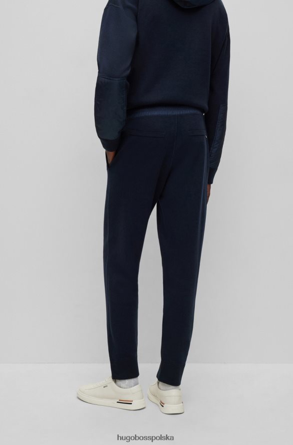 Hugo Boss Spodnie dresowe o regularnym kroju z bawełny i dziewiczej wełny hugo w kolorze ciemnoniebieskim ciemny niebieski R0X0H62866