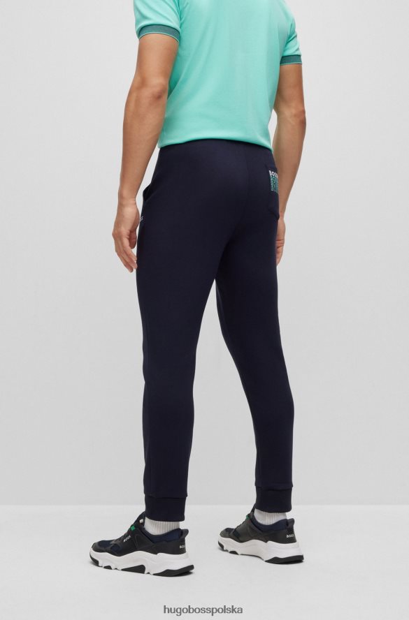 Hugo Boss Spodnie dresowe o regularnym kroju z wielobarwnymi logo hugo w kolorze granatowym ciemny niebieski R0X0H63528