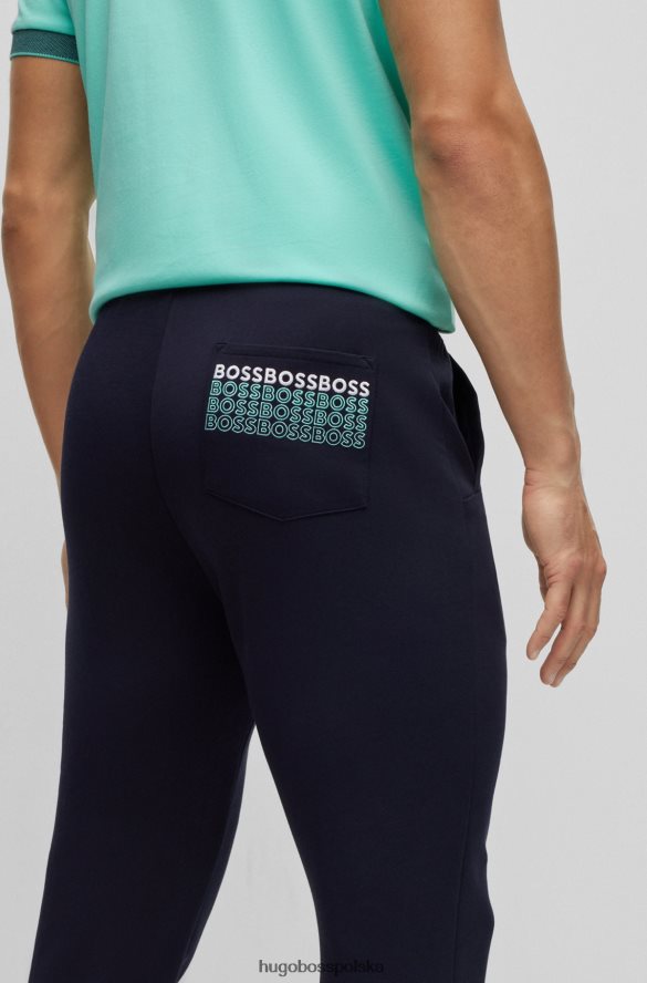 Hugo Boss Spodnie dresowe o regularnym kroju z wielobarwnymi logo hugo w kolorze granatowym ciemny niebieski R0X0H63528