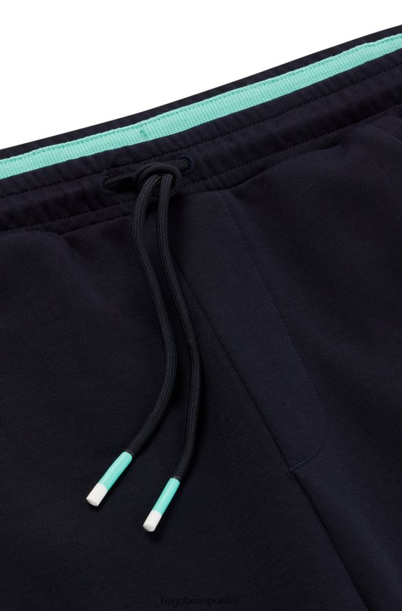 Hugo Boss Spodnie dresowe o regularnym kroju z wielobarwnymi logo hugo w kolorze granatowym ciemny niebieski R0X0H63528