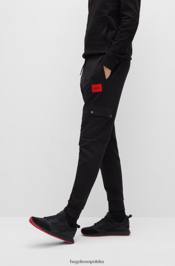 Hugo Boss Spodnie dresowe o swobodnym kroju z bawełny frotte i kieszenią cargo, czarne hugo czarny R0X0H62166