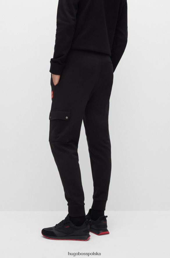 Hugo Boss Spodnie dresowe o swobodnym kroju z bawełny frotte i kieszenią cargo, czarne hugo czarny R0X0H62166
