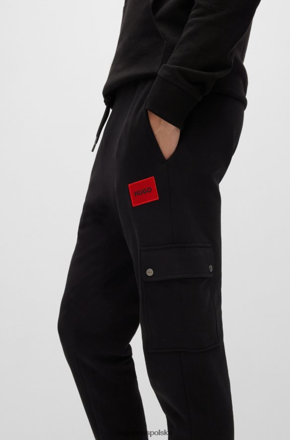 Hugo Boss Spodnie dresowe o swobodnym kroju z bawełny frotte i kieszenią cargo, czarne hugo czarny R0X0H62166