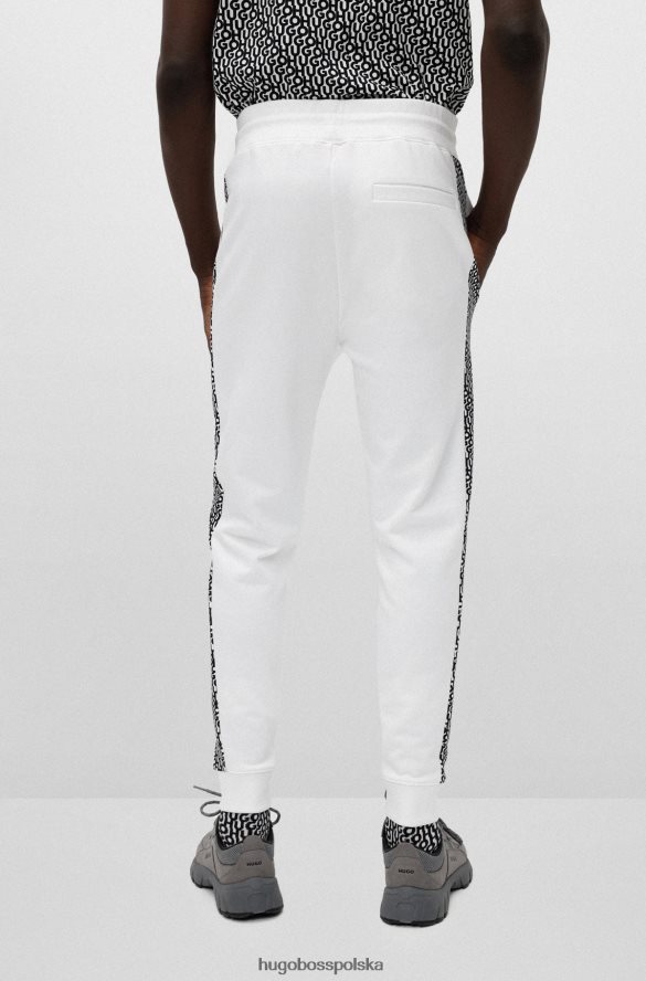 Hugo Boss Spodnie dresowe z bawełnianej froty z naszywką z logo i wstawkami hugo białe biały R0X0H62572