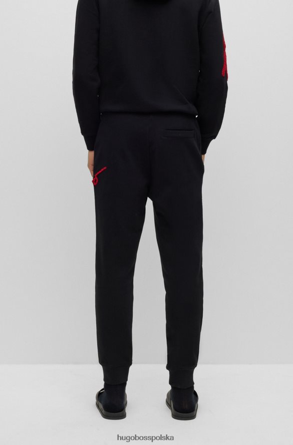 Hugo Boss Spodnie dresowe z bawełnianej froty z odręcznym haftem logo, czarne hugo czarny R0X0H63550