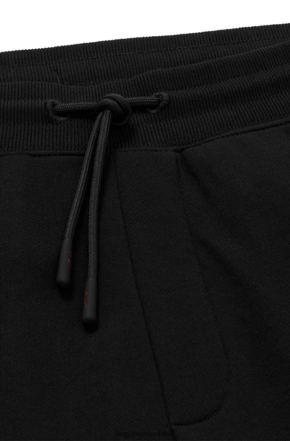 Hugo Boss Spodnie dresowe z bawełnianej froty z odręcznym haftem logo, czarne hugo czarny R0X0H63550
