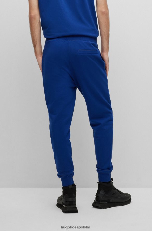 Hugo Boss Spodnie dresowe z bawełny frotte z grafiką z logo Hugo Blue niebieski R0X0H61953