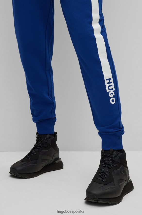Hugo Boss Spodnie dresowe z bawełny frotte z grafiką z logo Hugo Blue niebieski R0X0H61953
