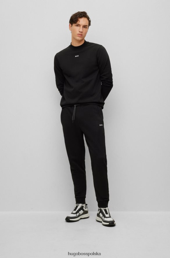 Hugo Boss Spodnie dresowe z bawełny frotte z kontrastowym logo Hugo w kolorze czarnym czarny R0X0H63288