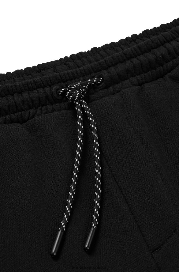 Hugo Boss Spodnie dresowe z bawełny frotte z kontrastowym logo Hugo w kolorze czarnym czarny R0X0H63288