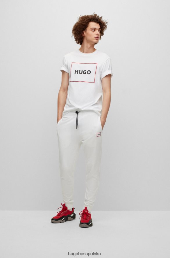 Hugo Boss Spodnie dresowe z bawełny frotte z logo w czerwonej ramce, białe hugo biały R0X0H61069