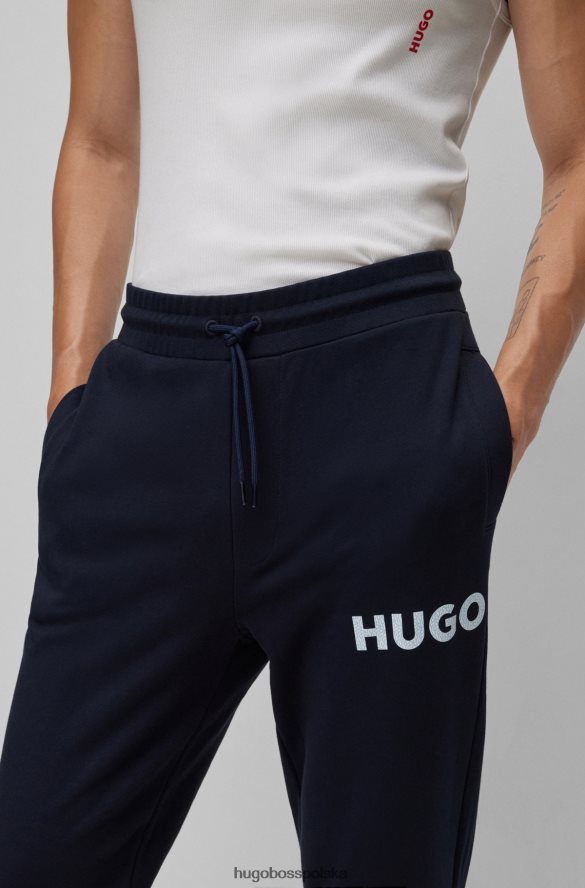 Hugo Boss Spodnie dresowe z bawełny frotte z logo w kolorze ciemnoniebieskim hugo ciemny niebieski R0X0H62576